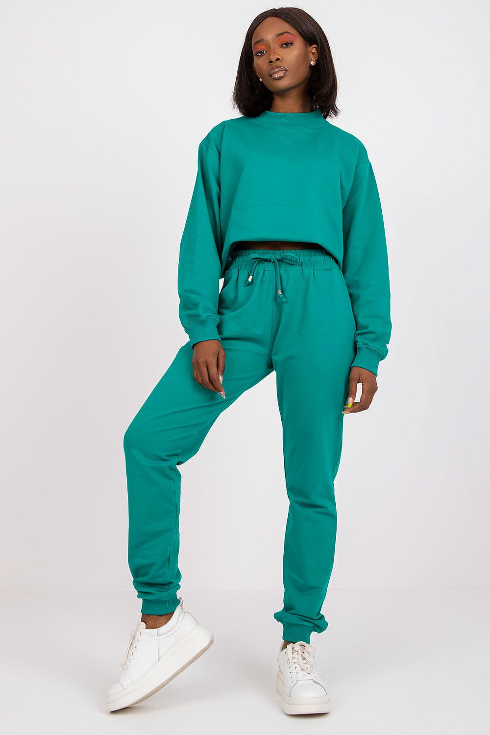 BFG High Rise Tracksuit Trousers with Drawstring Waist and Side Slash Pockets, stylish model in turquoise tracksuit, embodying chic athleisure for any occasion.