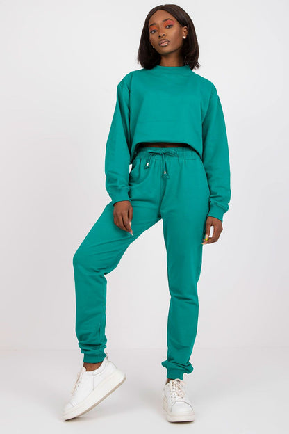 BFG High Rise Tracksuit Trousers with Drawstring Waist and Side Slash Pockets, stylish model in turquoise tracksuit, embodying chic athleisure for any occasion.