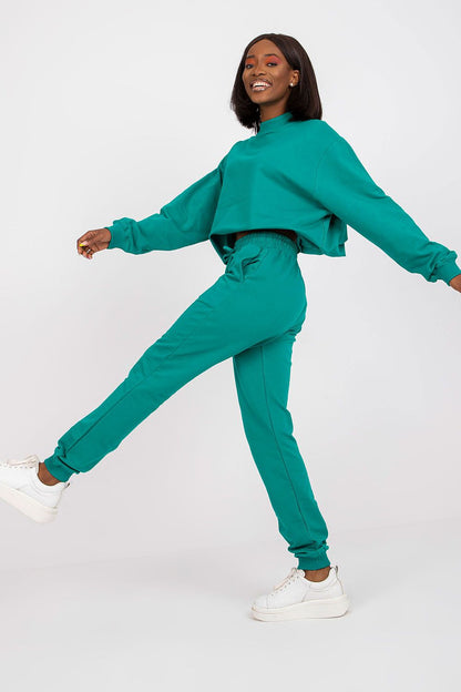 BFG High Rise Tracksuit Trousers With Drawstring Waist And Side Slash Pockets - Cotton Blend Comfort, showcased by a model in vibrant turquoise, expressing comfort and luxury in athleisure wear.