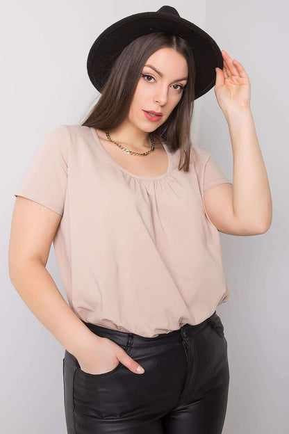 BFG Women's Plus Size T-Shirt in soft beige cotton blend, featuring short sleeves and a round neckline, stylishly worn with black leather trousers, exuding luxury. Available in sizes 2XL to 4XL.
