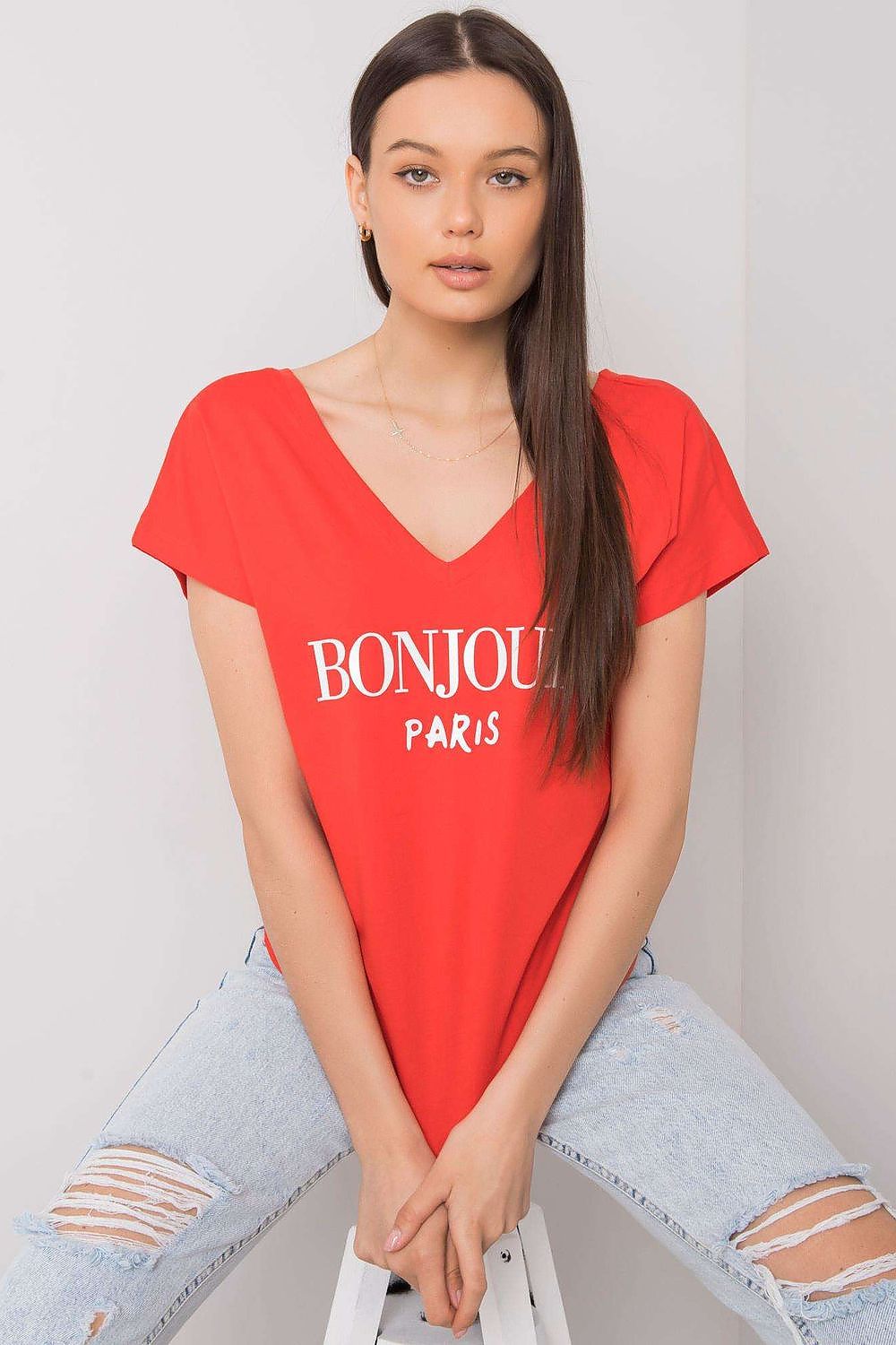 Luxury Cotton T-Shirt with Heart-Shaped Neckline and Decorative Inscription - Available in EU Size 0, showcased in red with 'BONJOUR PARIS' on the front, elegantly posed by a model.