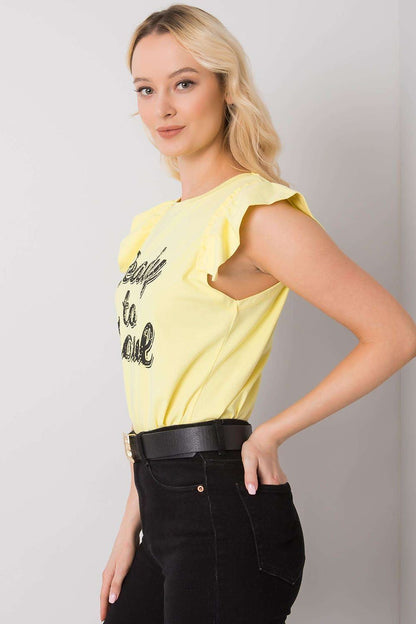 Side profile of the Elegant Short Sleeve Frill Blouse with Decorative Inscription in yellow, highlighting the unique frill design and embellished neckline, ideal for a sophisticated casual look.