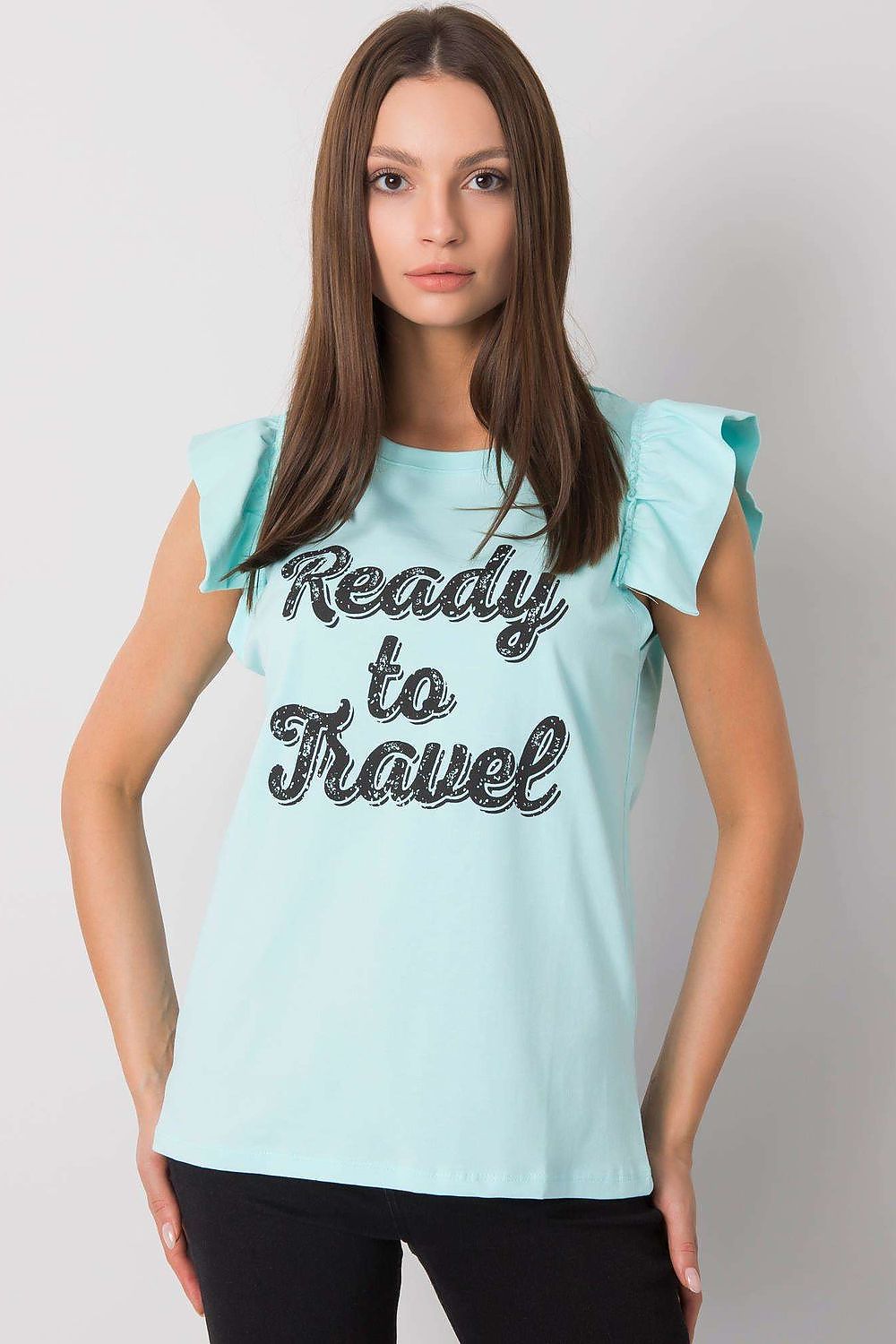 Elegant Short Sleeve Frill Blouse with Decorative Inscription - Cotton and Lycra Blend, front view of a model in a light blue frill blouse with 'Ready to Travel' inscription, complemented by stylish black pants.