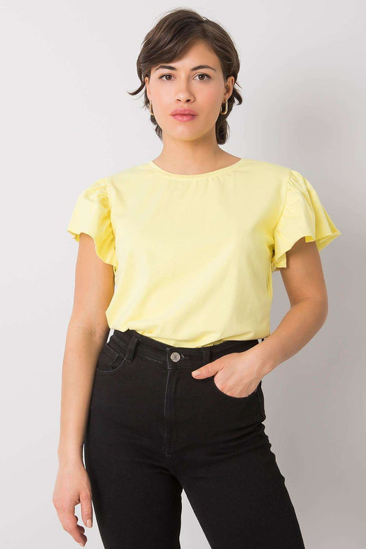 Elegant Cotton And Lycra Frill Sleeve Blouse With Round Neckline showcased in a vibrant yellow colour, perfect for any occasion, worn with high-waisted black jeans.