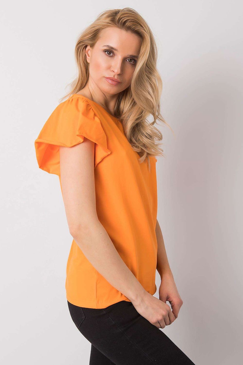 Elegant Cotton And Lycra Frill Sleeve Blouse With Round Neckline – Perfect For Any Occasion, displayed by a model in a chic pose, highlighting the flattering cut and luxurious fabric of the blouse in a striking orange hue.