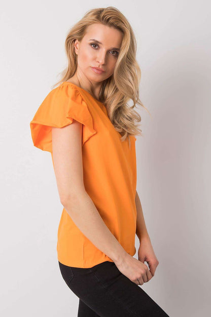 Elegant Cotton And Lycra Frill Sleeve Blouse With Round Neckline – Perfect For Any Occasion, displayed by a model in a chic pose, highlighting the flattering cut and luxurious fabric of the blouse in a striking orange hue.