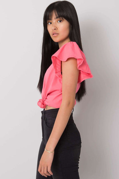 Elegant Frill Sleeve Blouse with Round Neckline in vibrant pink, showcasing a model styled in casual chic with high-waisted black jeans.