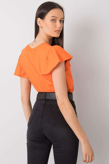 Elegant Frill Sleeve Blouse with Round Neckline in classic orange, styled elegantly with a black belt, highlighting modern fashion trends.