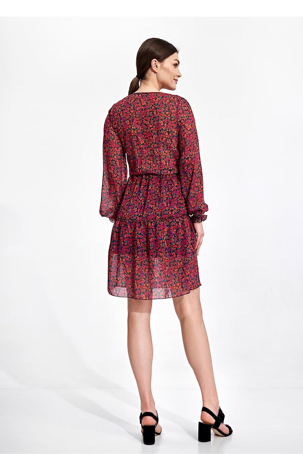 Elegant Figl Summer Mini Dress with Long Sleeves, Ruffle Hem, and Waist Detail, model captured from the back, illustrating the delicate details in a stunning floral print.