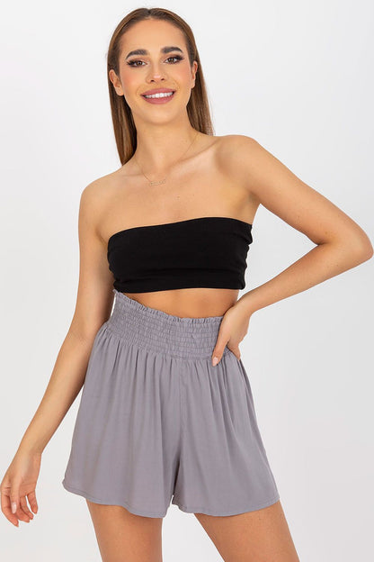Luxury Women's High-Waisted Loose Fit Shorts in 100% Viscose - Fresh Made Collection, model wearing slate grey shorts with a black strapless top, showcasing elegant casual wear.