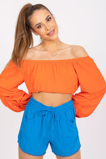 Luxury Women's Viscose Shorts with Elastic Waist and Pockets - Fresh Made Essentials, model wearing a bold orange off-shoulder top paired with bright blue shorts, exuding elegance and summer vibes.