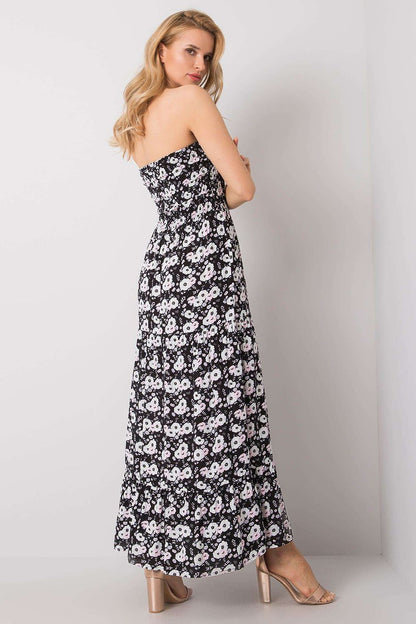Back view of an elegant strapless long summer dress with ruffle hem and floral design, highlighting the fashionable silhouette, made from 100% viscose by Fresh Made.