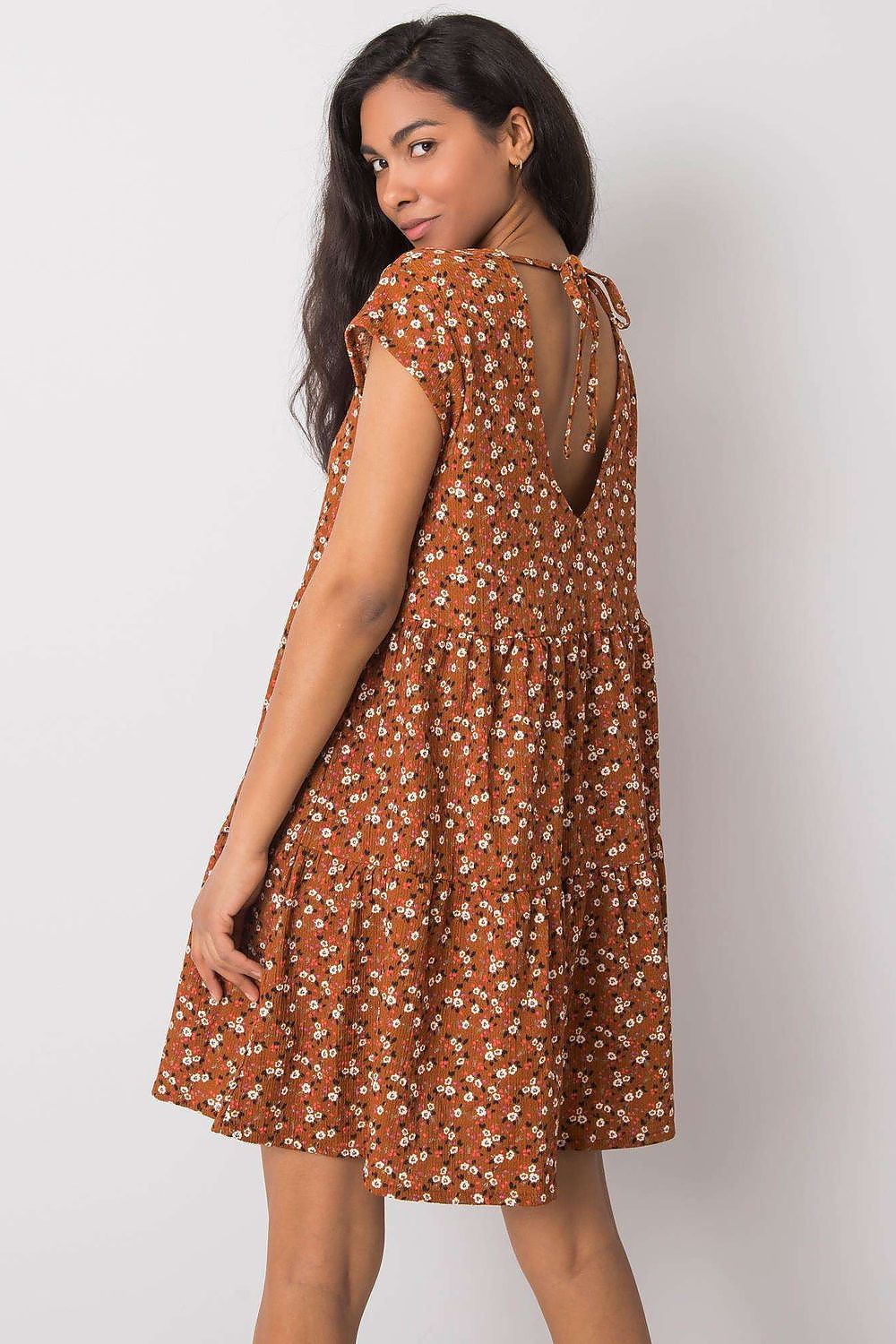 Elegant loose-fitting daydress by Stitch&Soul featuring a chic back tie detail, providing a stylish look with a delicate floral design, perfect for luxury casual wear.