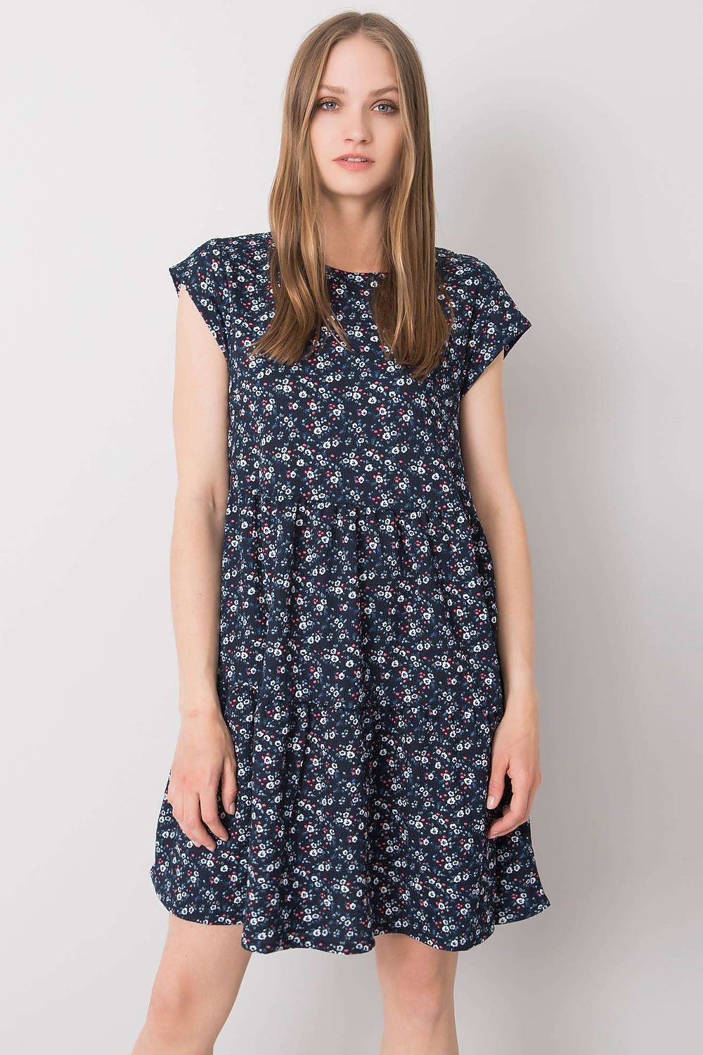 Elegant Loose-Fitting Daydress by Stitch&Soul showcasing a model wearing a short-sleeved floral dress with a round neckline.