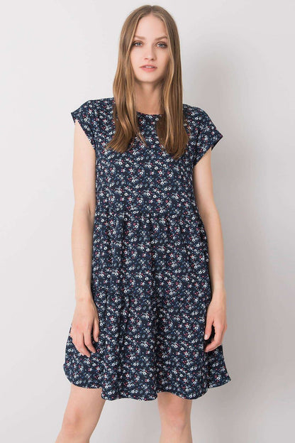 Elegant Loose-Fitting Daydress by Stitch&Soul showcasing a model wearing a short-sleeved floral dress with a round neckline.