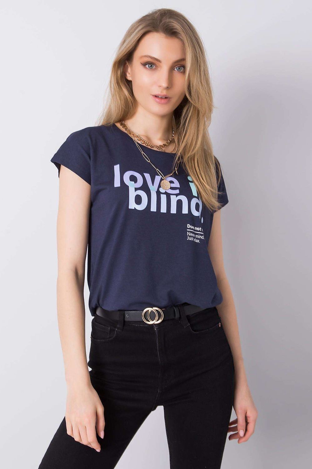 Luxurious Stitch&Soul Women's Short Sleeve T-Shirt with Decorative Inscription, featuring a model in a navy t-shirt adorned with 'love is blind' statement, styled with black high-waisted jeans and elegant accessories.
