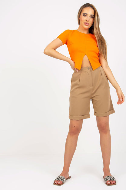 Chic Xsapienza higher-waisted shorts in beige, elegantly styled with a trendy orange top, showcasing zipper closure and side slip pockets.