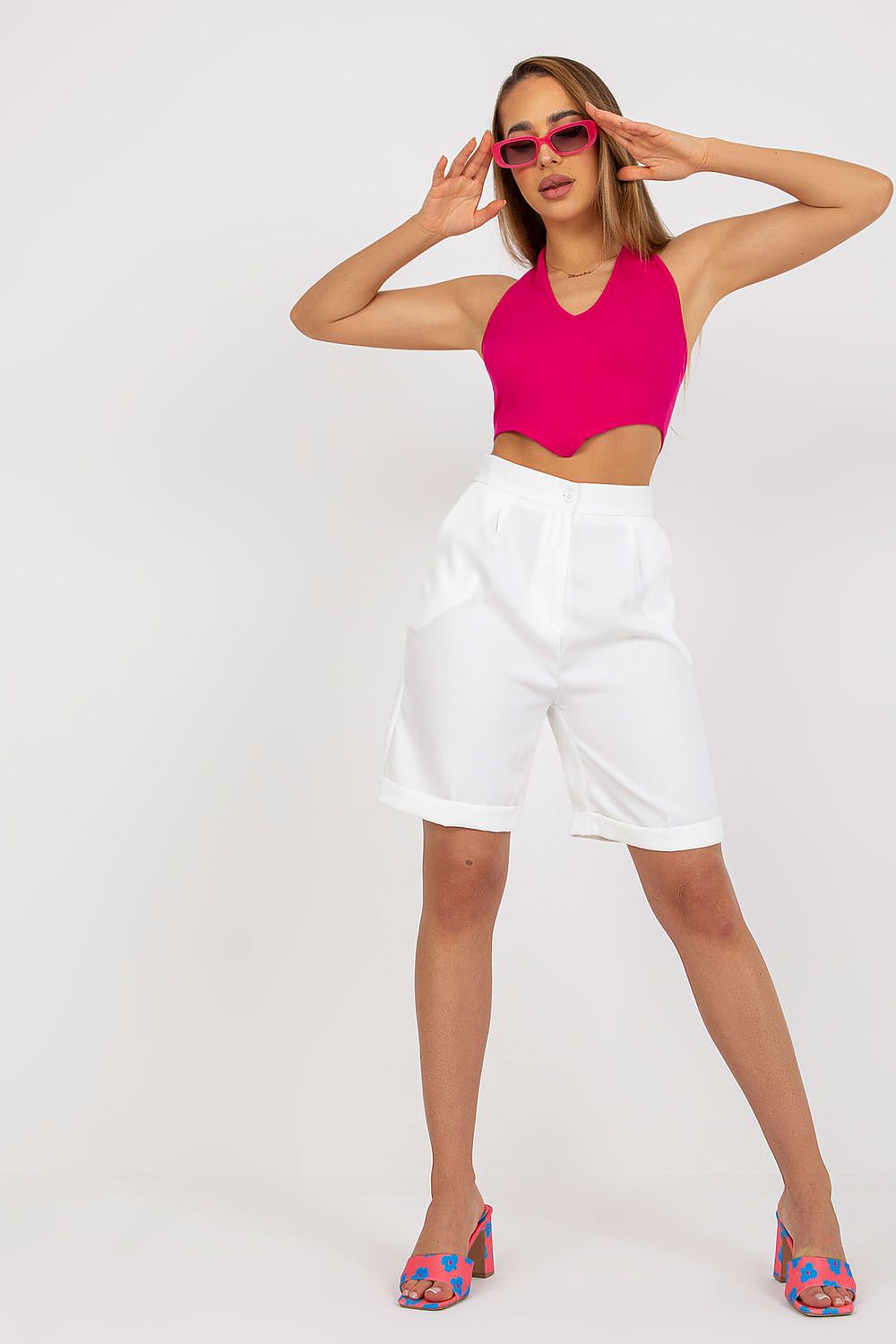 Fashionable Xsapienza Higher-Waisted Shorts with Zipper Closure, beautifully styled with a pink top and pink sunglasses, exuding luxury and sophistication.