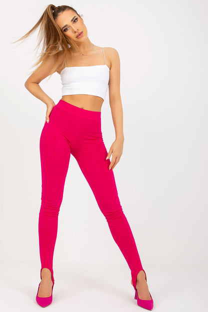 Fashionable model in pink Luxury High-Waist Leggings with Wide Rubber Band paired with a white crop top, exuding elegance and style.