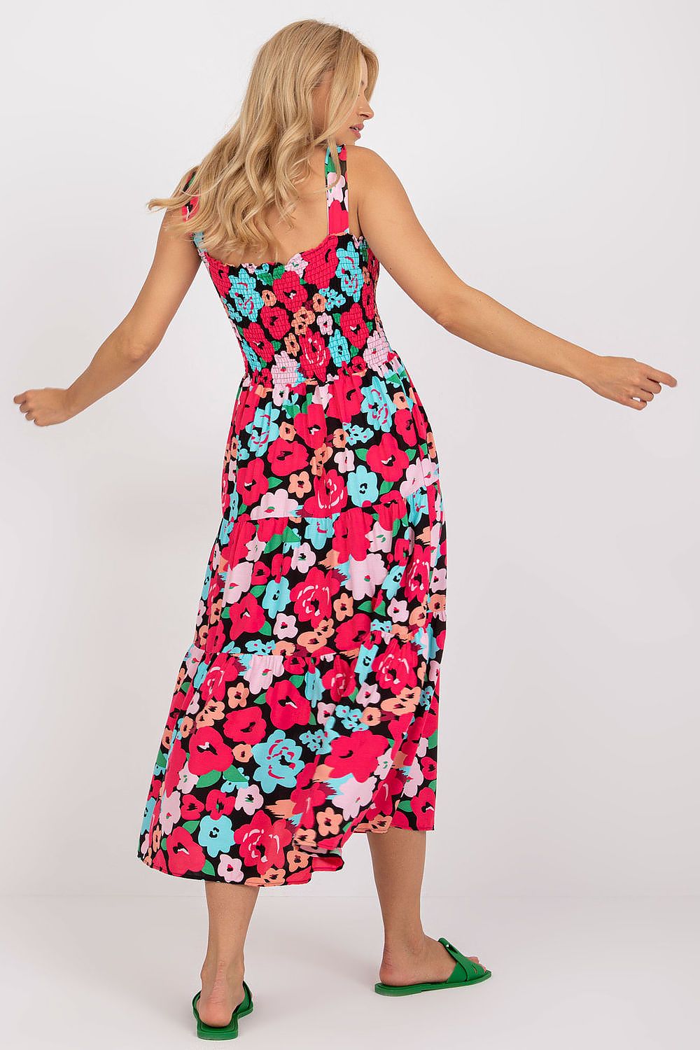 Back view of the Floral Summer Dress by Rue Paris, highlighting the luxurious flared frill design and wide straps in a vibrant floral pattern, ideal for stylish summer outings.