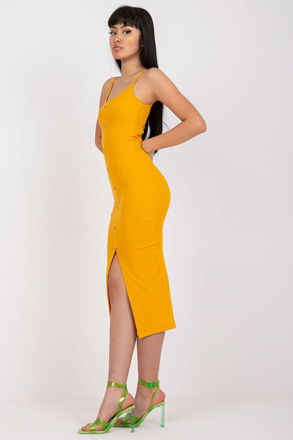Chic side view of the Elegant Ribbed Summer Dress With Straps And Decorative Buttons By Rue Paris, highlighting the flattering fit and luxurious ribbed texture in eye-catching yellow, perfect for warm days.