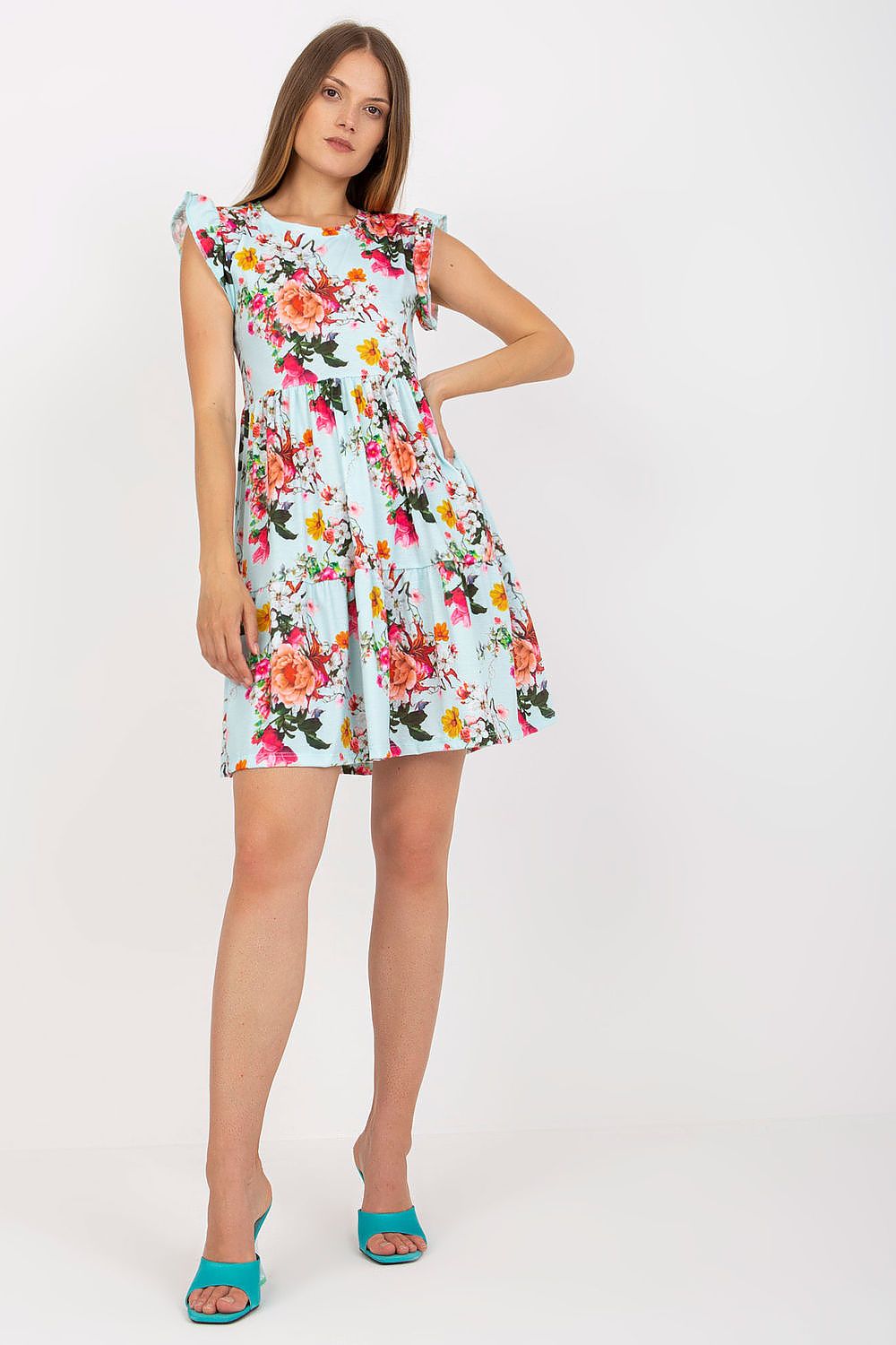 Luxury Floral Summer Dress with Frill Sleeves by Rue Paris on model, showcasing vibrant floral patterns and a flared skirt, perfect for summer occasions. Available in sizes S, M, L.