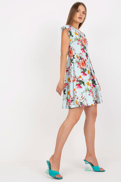 Luxury Floral Summer Dress with Frill Sleeves by Rue Paris displayed elegantly on model, highlighting the short frill sleeves and flared design, ideal for a chic summer look. Available in sizes S, M, L.