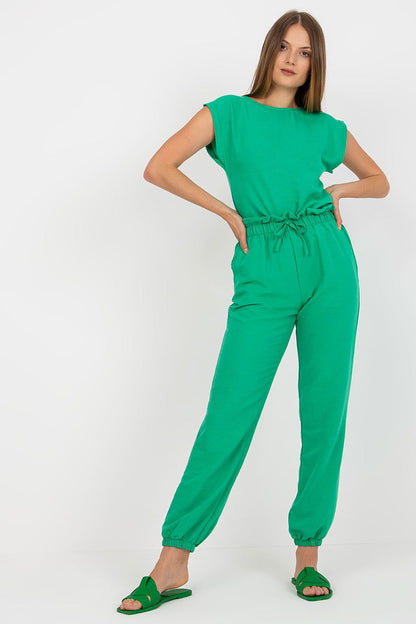 Model wearing the Elegant Rue Paris Summer Set in a vibrant green colour, displaying the stylish blouse and comfortable long pants, ideal for warm weather elegance.