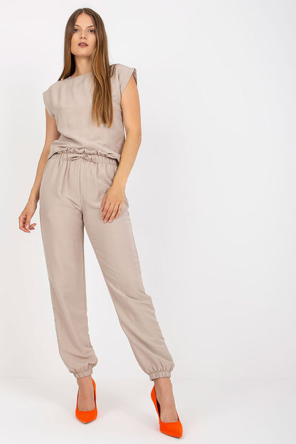 Elegant Rue Paris Summer Set in a sophisticated beige hue, featuring a classic blouse and comfortable long pants, perfect for stylish summer outings.