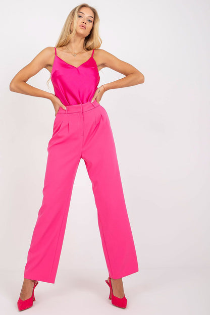 Luxurious Wide Leg Women’s Trousers by Rue Paris - Stylish Fabric Pants with Pockets. A model poses confidently in bright pink wide-leg trousers, styled elegantly with a satin top.