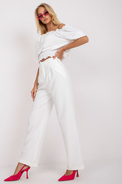 Stylish display of Luxurious Wide Leg Women’s Trousers by Rue Paris on a model with a white off-shoulder top and chic pink sunglasses, creating a trendy and luxurious summer outfit.