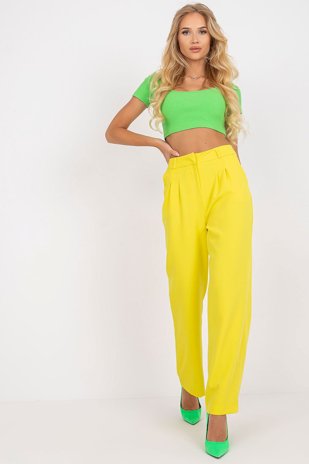 Luxurious wide leg women’s trousers by Rue Paris in vibrant yellow, styled with a chic green crop top and matching heels, showcasing elegant and stylish fabric with pockets.