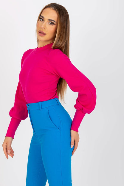 Side view of the Elegant Long Sleeve Ribbed Blouse by Rue Paris in radiant pink, worn with stylish blue trousers, emphasizing the luxurious cotton and spandex fabric.