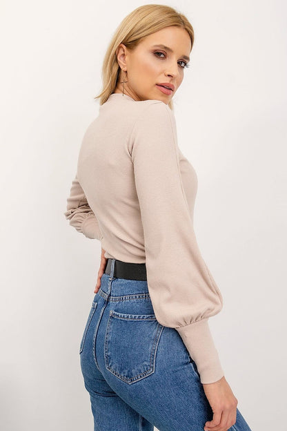 Elegant Long Sleeve Ribbed Blouse by Rue Paris showcased from the back, highlighting the luxurious cotton and spandex material with ribbed details, styled with blue jeans for a sophisticated outfit.