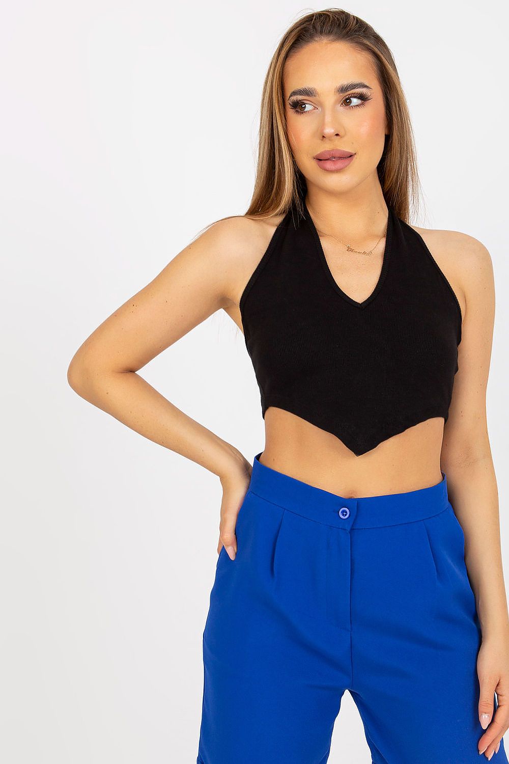 Elegant ribbed cotton top by Rue Paris, showcased by a model in black, paired with chic blue trousers, perfect for stylish summer outings.