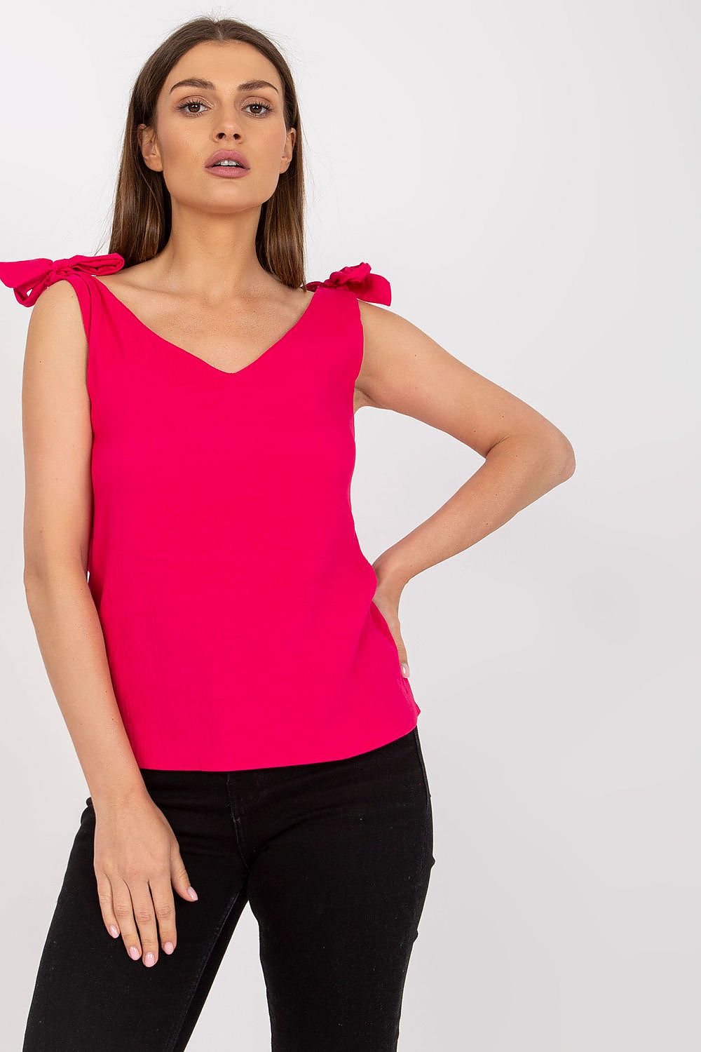 Elegant Rue Paris Top with Heart Neckline and Decorative Ties, presented in a striking pink colour on a model, embodying luxurious style.