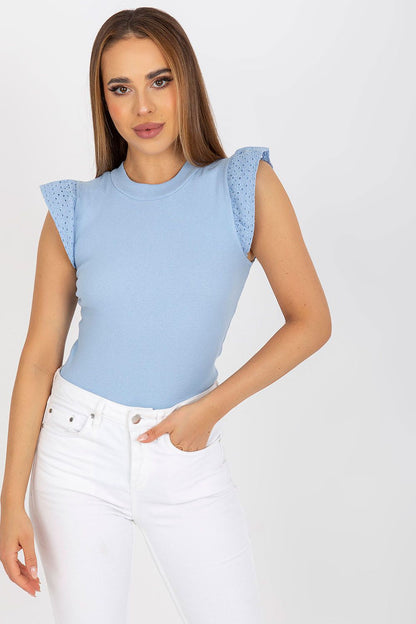 Elegant Rue Paris Frill Sleeve Blouse in soft blue, highlighting the beautiful frill sleeve design and paired with white trousers, epitomising elegance for everyday wear.
