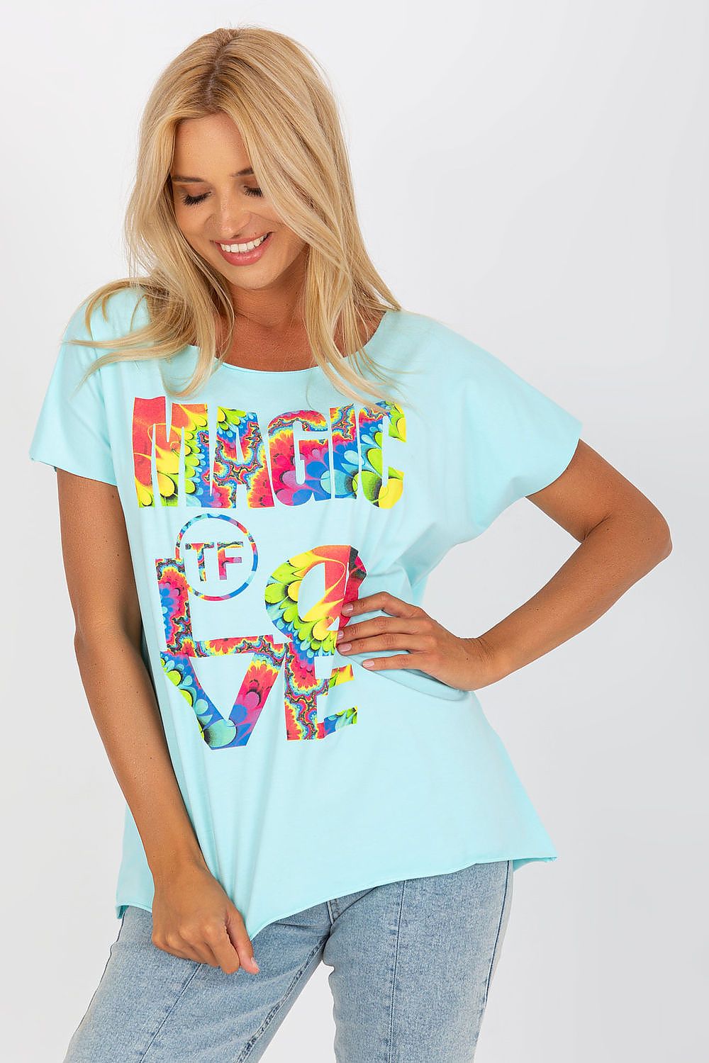 Elegant Straight Cut Cotton Spandex Blouse with Decorative Print – Short Sleeves, EU Size 0, model showcasing the blouse in light blue with a vibrant print, paired with denim.