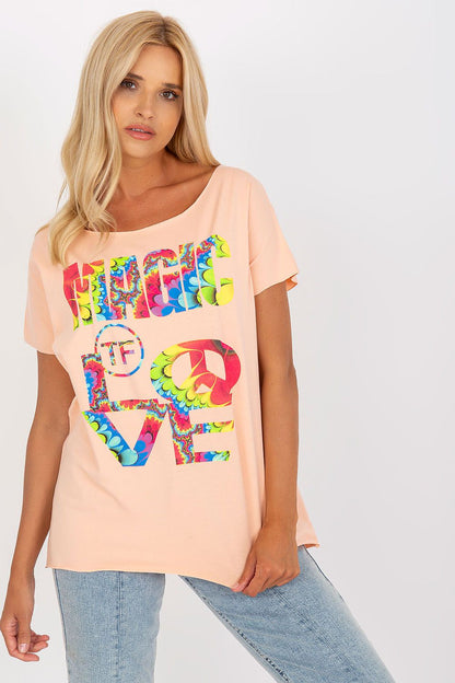 Elegant Straight Cut Cotton Spandex Blouse with Decorative Print – Short Sleeves, EU Size 0, model in an engaging pose displaying the blouse in peach, featuring an eye-catching graphic design.