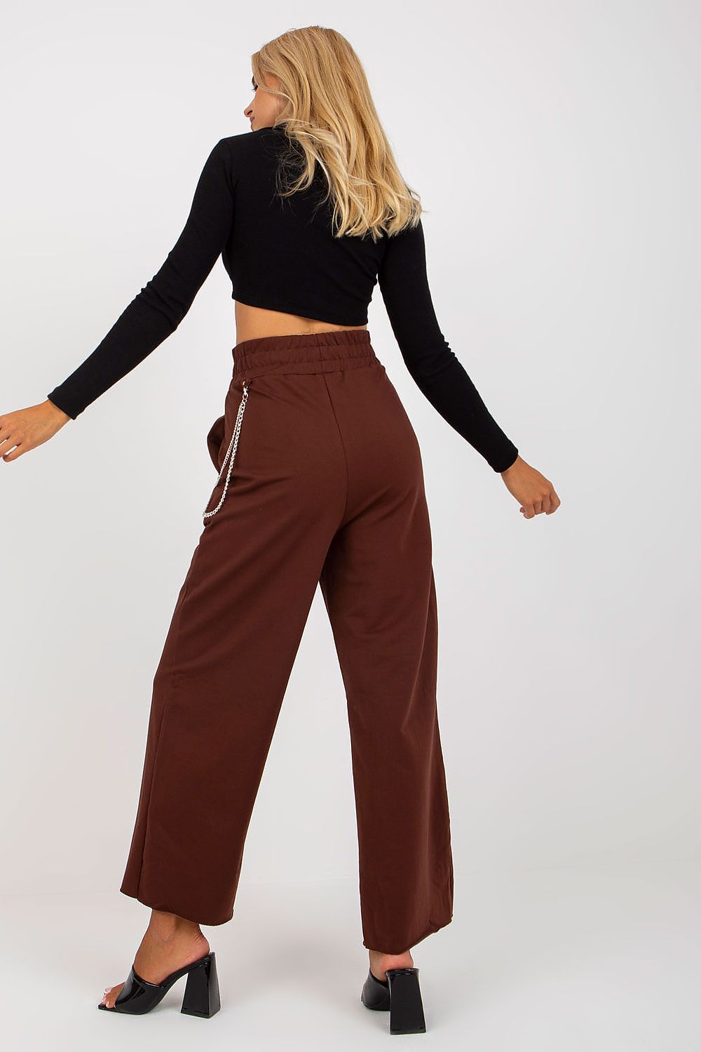 Luxury Women's Wide Leg Sweatpants with Pockets, Elastic Waistband and Decorative Slits showcased in brown, featuring a stylish model from the back, highlighting the chic wide-leg design and trendy chain detail.