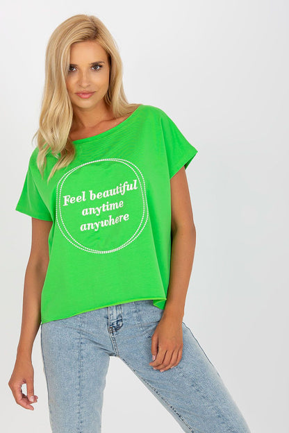 Elegant Short-Sleeved Blouse with Embroidery - Cotton and Spandex Blend, Loose Fit, featuring a model in a vibrant green blouse with sophisticated embroidery.