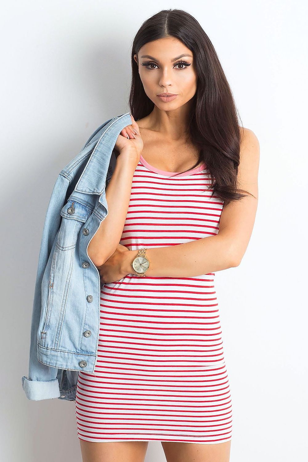 Elegant Summer Strapless Striped Mini Dress by Yups in a vibrant red colour scheme, model posing with a denim jacket for a relaxed summer look.