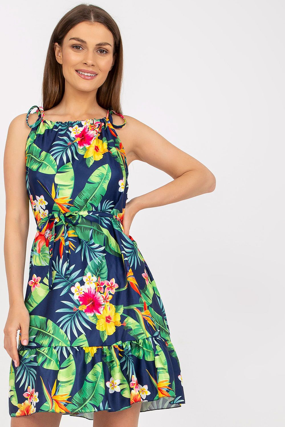 Elegant Summer Dress by Rue Paris with Colorful Pattern, Tied Straps, and Flattering Ruffles, model presenting a luxurious tropical design dress, perfect for summer occasions.