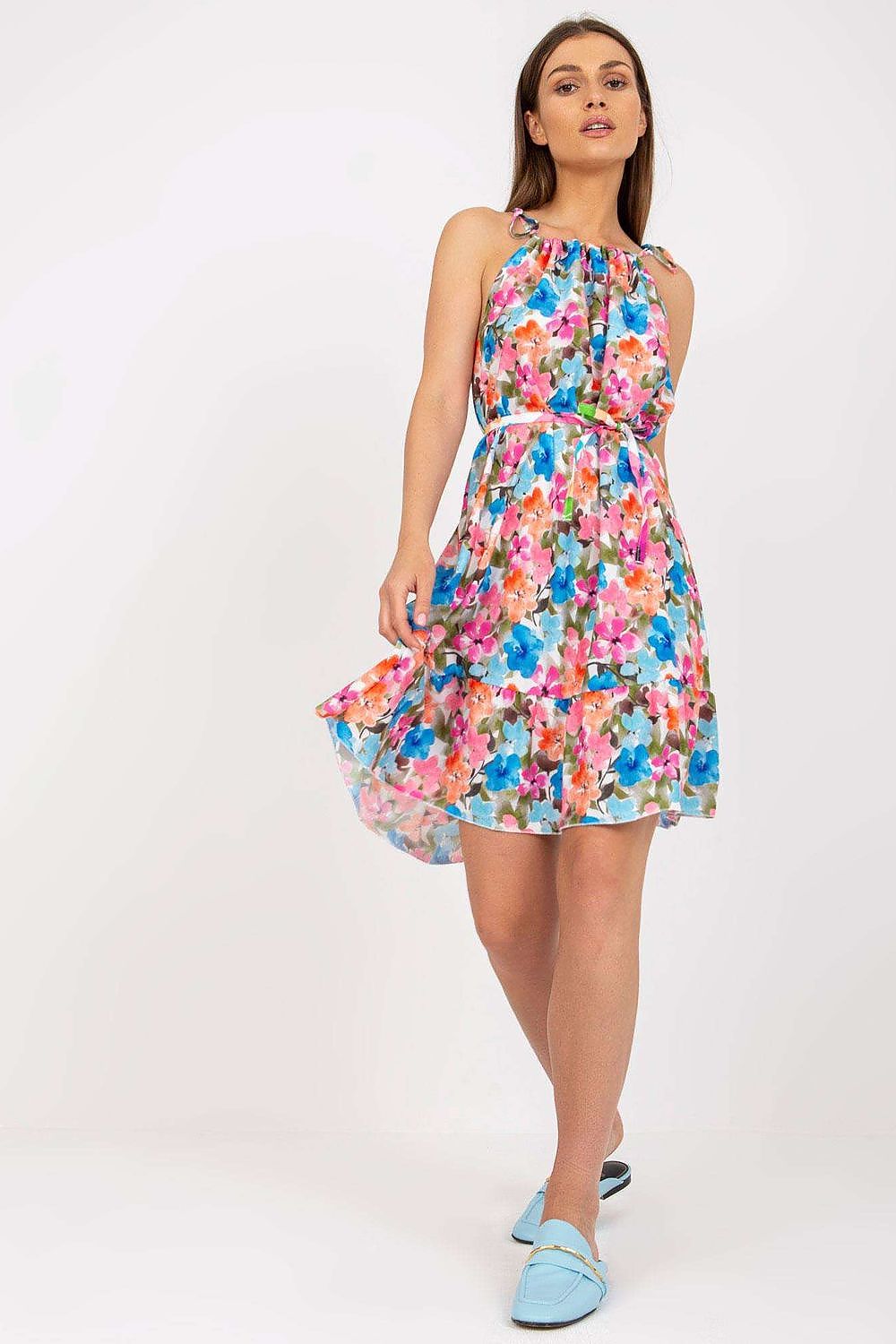 Elegant Summer Dress by Rue Paris with a colourful floral design, tied straps, and ruffled hem, presented elegantly on a model standing frontally.