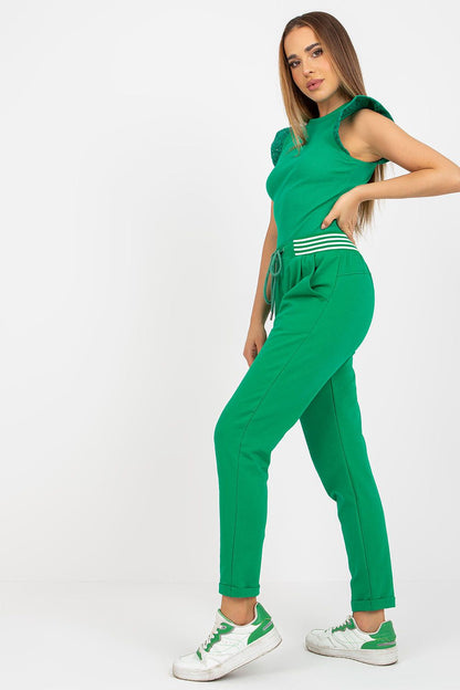 Elegant High-Waisted Sweatpants with Pockets modelled in a striking green ensemble, featuring thoughtful design elements like side pockets and a trendy silhouette, perfect for contemporary women's fashion.
