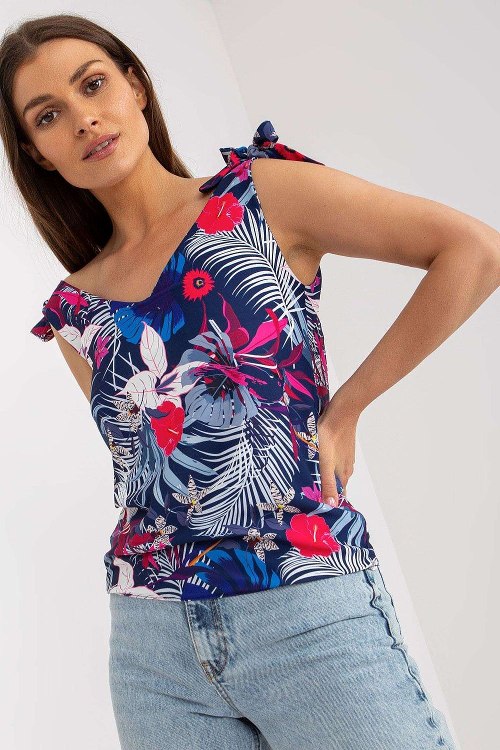 Elegant Heart Neckline Top with Decorative Ties in 100% Polyester by Rue Paris, featuring a floral print, model posing with a charming smile.