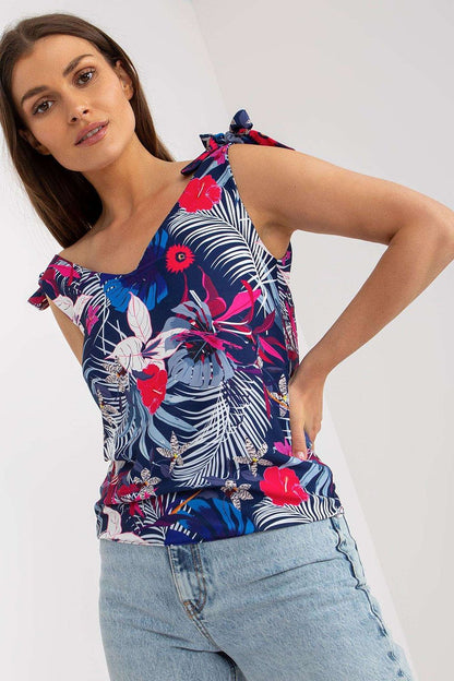 Elegant Heart Neckline Top with Decorative Ties in 100% Polyester by Rue Paris, featuring a floral print, model posing with a charming smile.