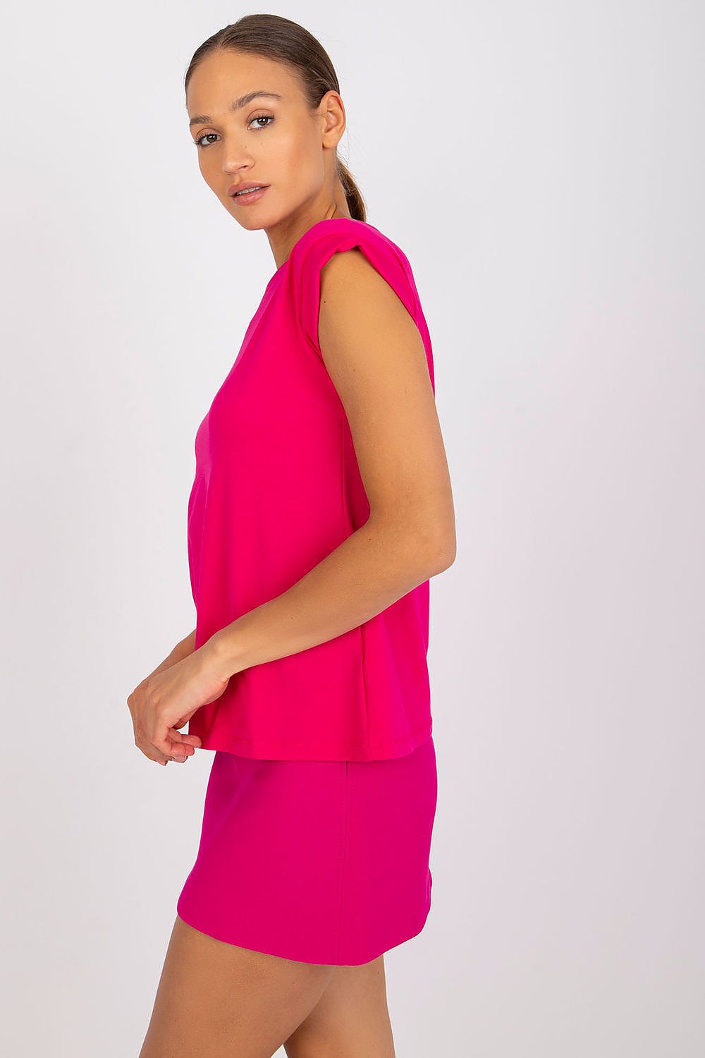 Chic side view of Women's Luxurious BFG Cotton Spandex T-Shirt in radiant pink, showcasing short sleeves and a flattering round neckline, ideal for a luxurious casual look.