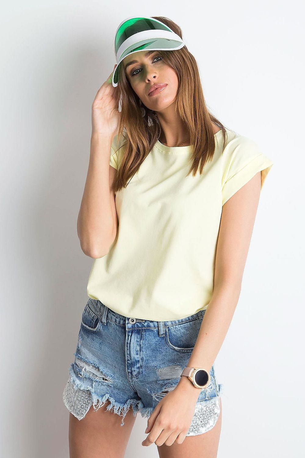 Women's Luxurious BFG Cotton Spandex T-Shirt in pale yellow, styled with casual denim shorts and a visor, epitomising summer elegance.