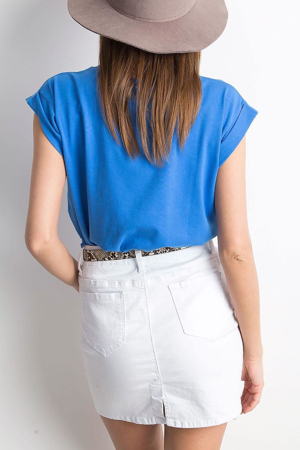 Back view of a model wearing the Women's Luxurious BFG Cotton Spandex T-Shirt - Short Sleeve Round Neckline, Perfect Fit, paired with a white skirt, exuding a contemporary and elegant aesthetic.